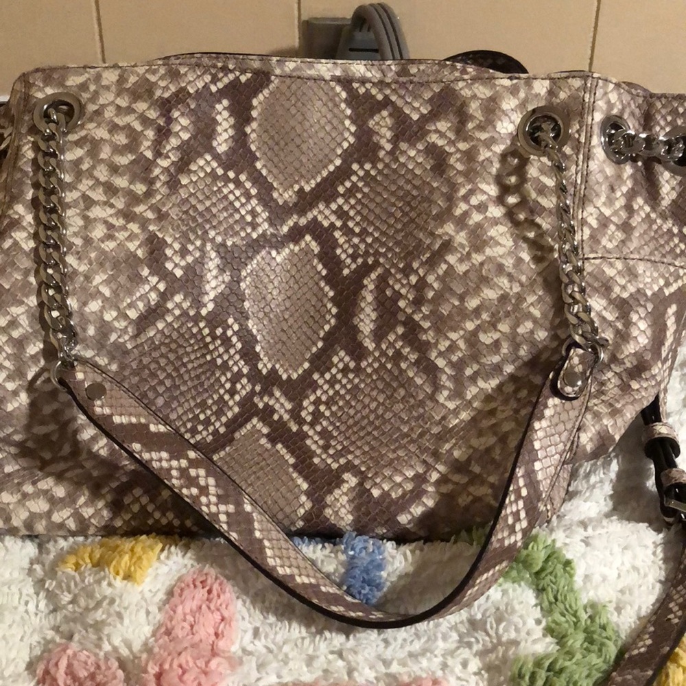 Michael kors snake skin bag. Like new without tags. No rips stains or tears
